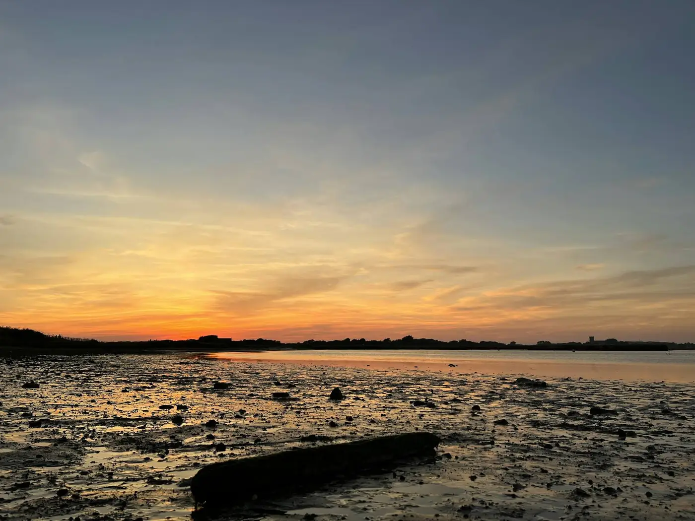 Sunset over the estuary mud flats